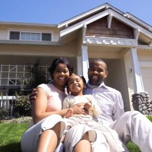 rain carriers home improvement gutters siding 2 happy family sitting in front of their home with new gutters by rain carriers va